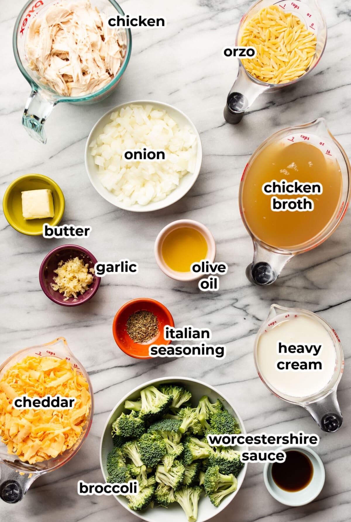 ingredients for cheesy chicken broccoli orzo in prep bowls