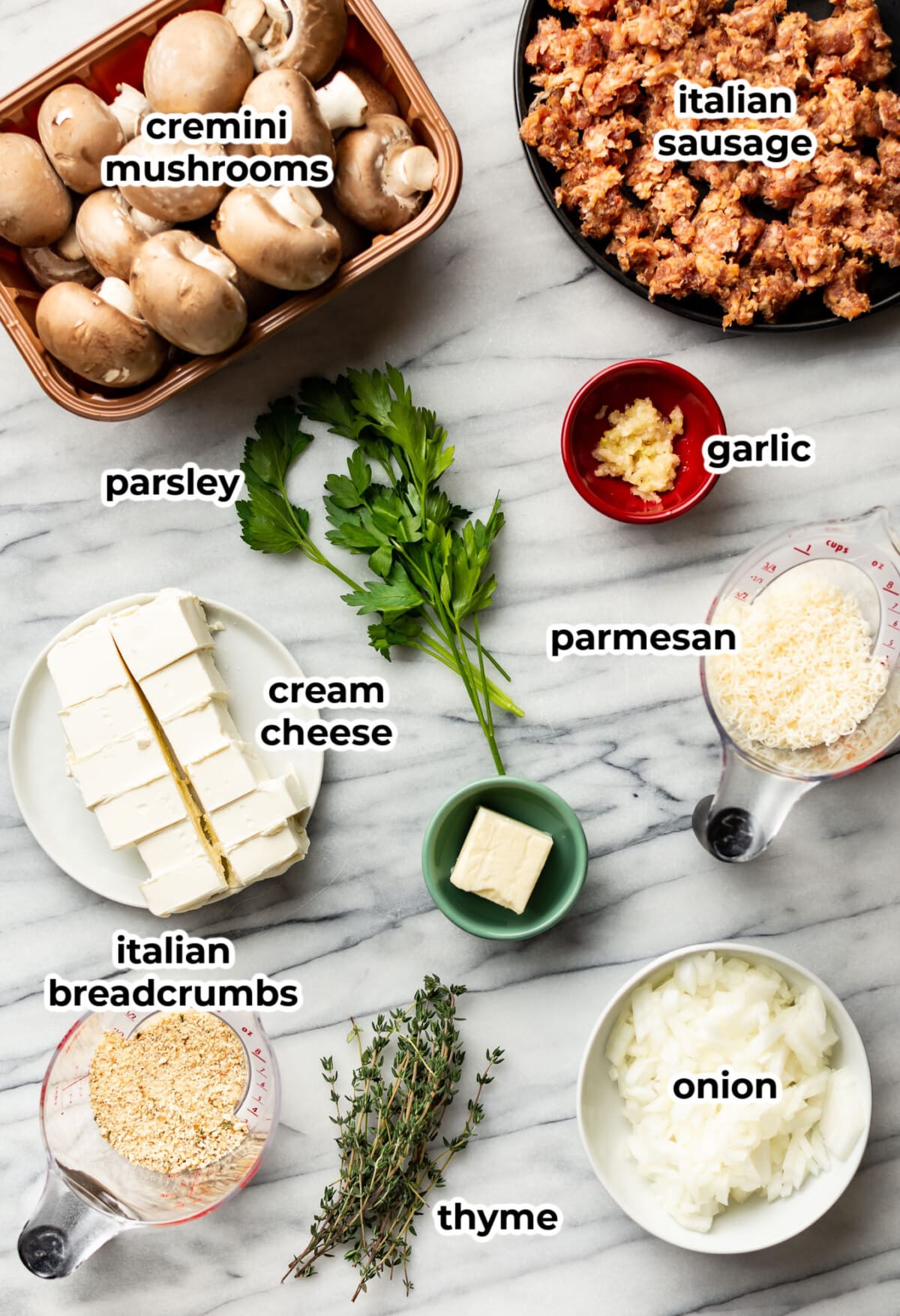 ingredients for sausage stuffed mushrooms in prep bowls