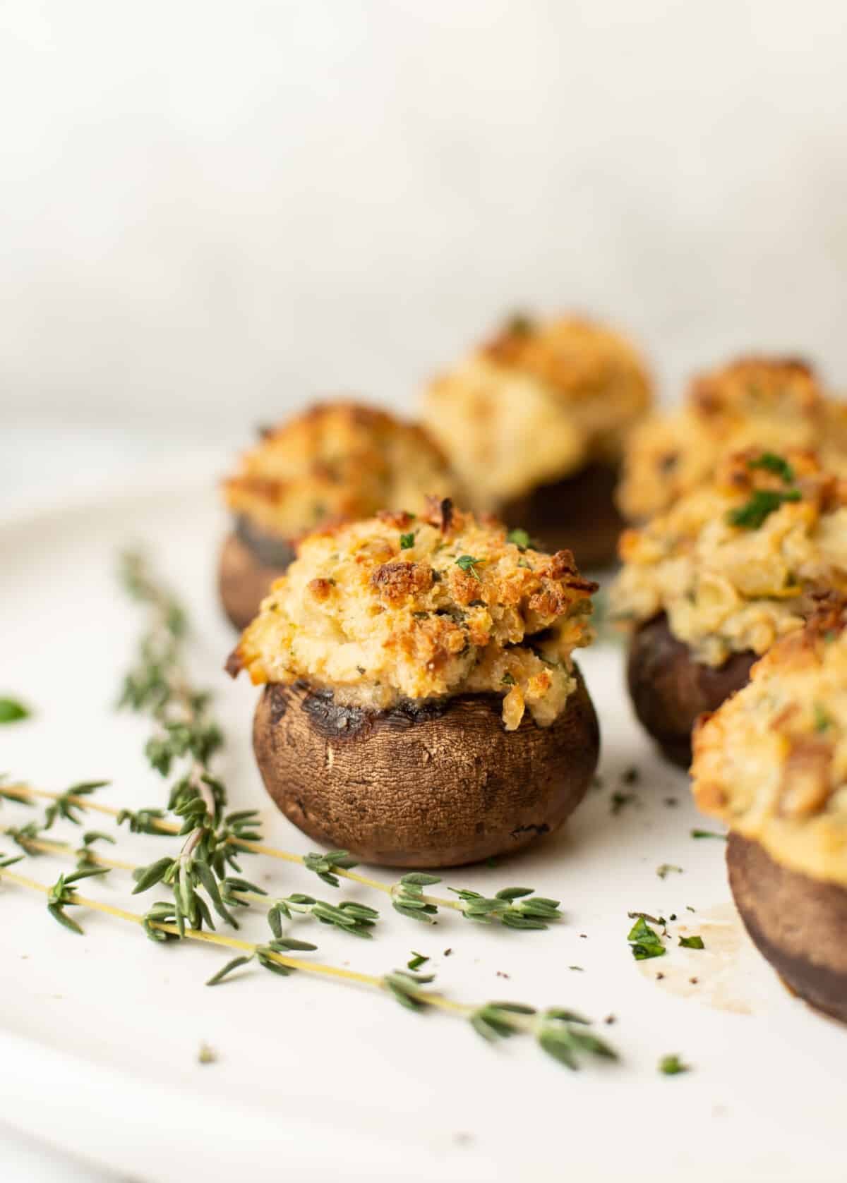 a plate with several stuffed mushrooms