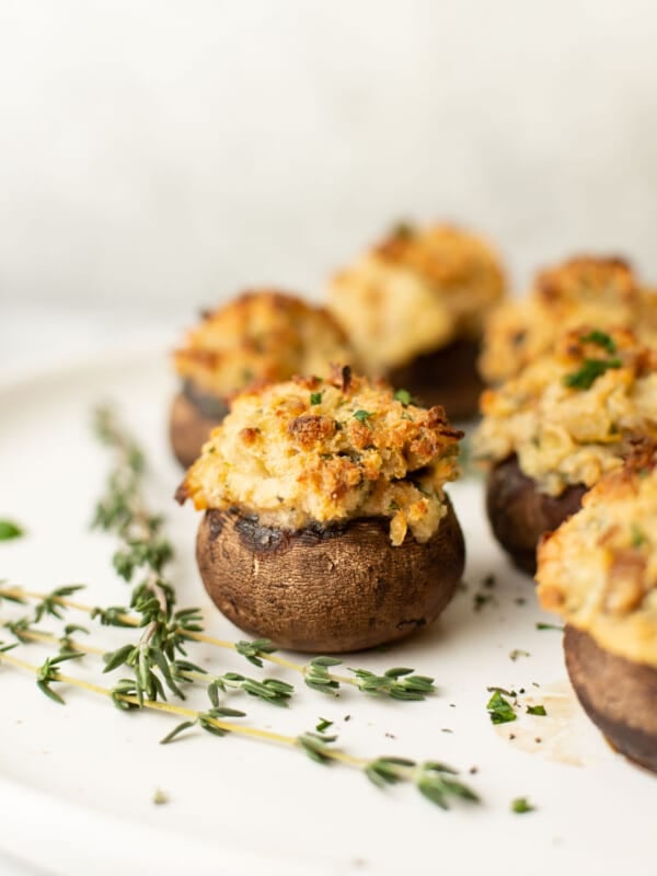 a plate with several stuffed mushrooms