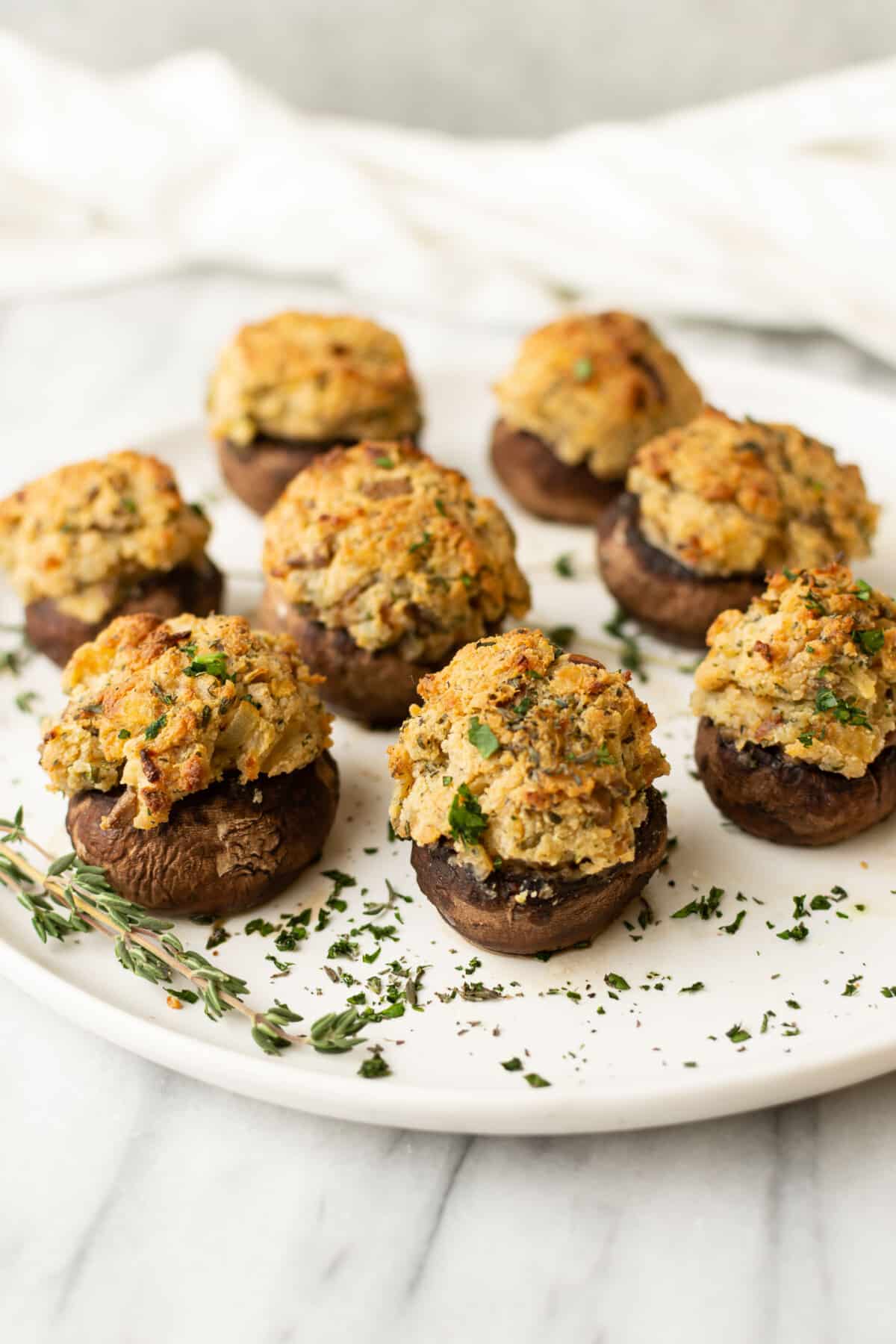 a plate with several stuffed mushrooms