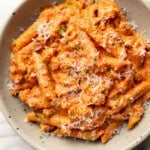 a bowl of italian sausage tomato pasta with parmesan