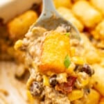 closeup of a spoonful of cowboy casserole over a baking dish