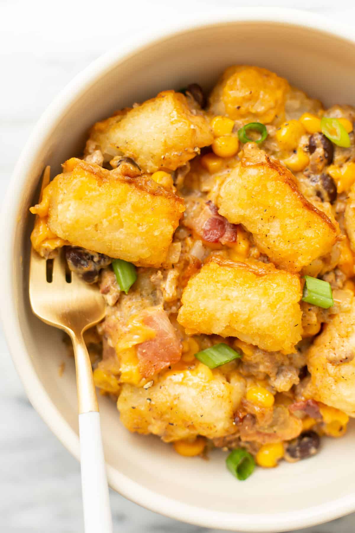 a bowl of cowboy casserole with a fork