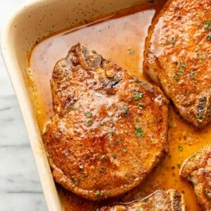 closeup of a casserole dish with baked pork chops
