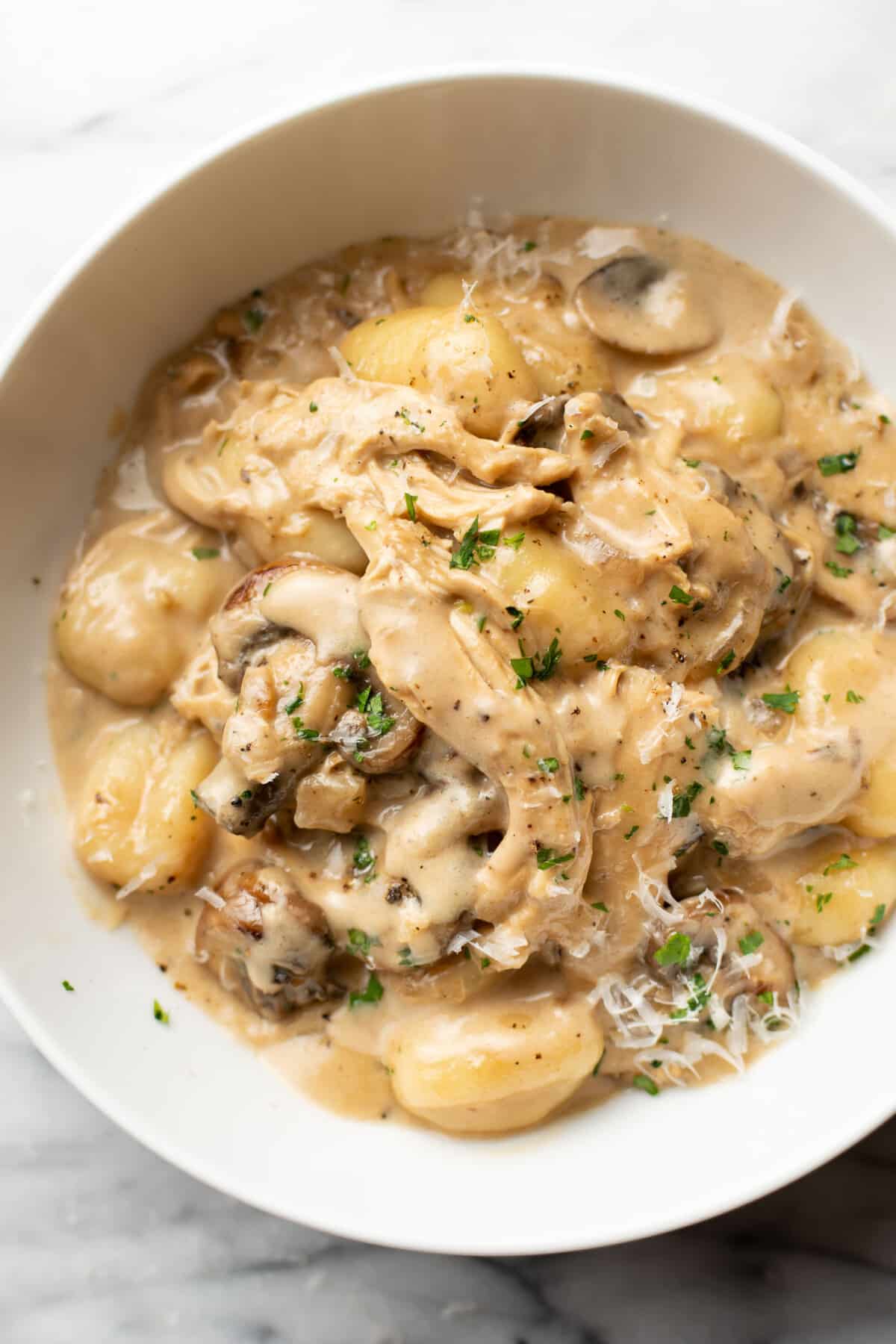 a bowl of chicken marsala gnocchi