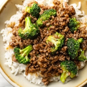 a bowl with ground beef and broccoli over rice