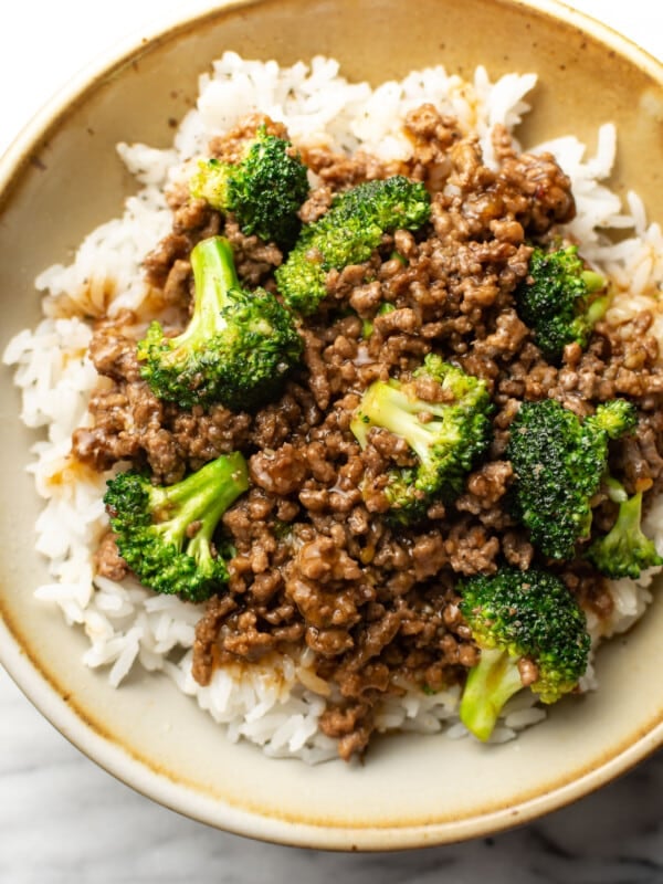 a bowl with ground beef and broccoli over rice