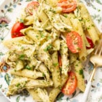 a plate with chicken pesto pasta salad and a fork