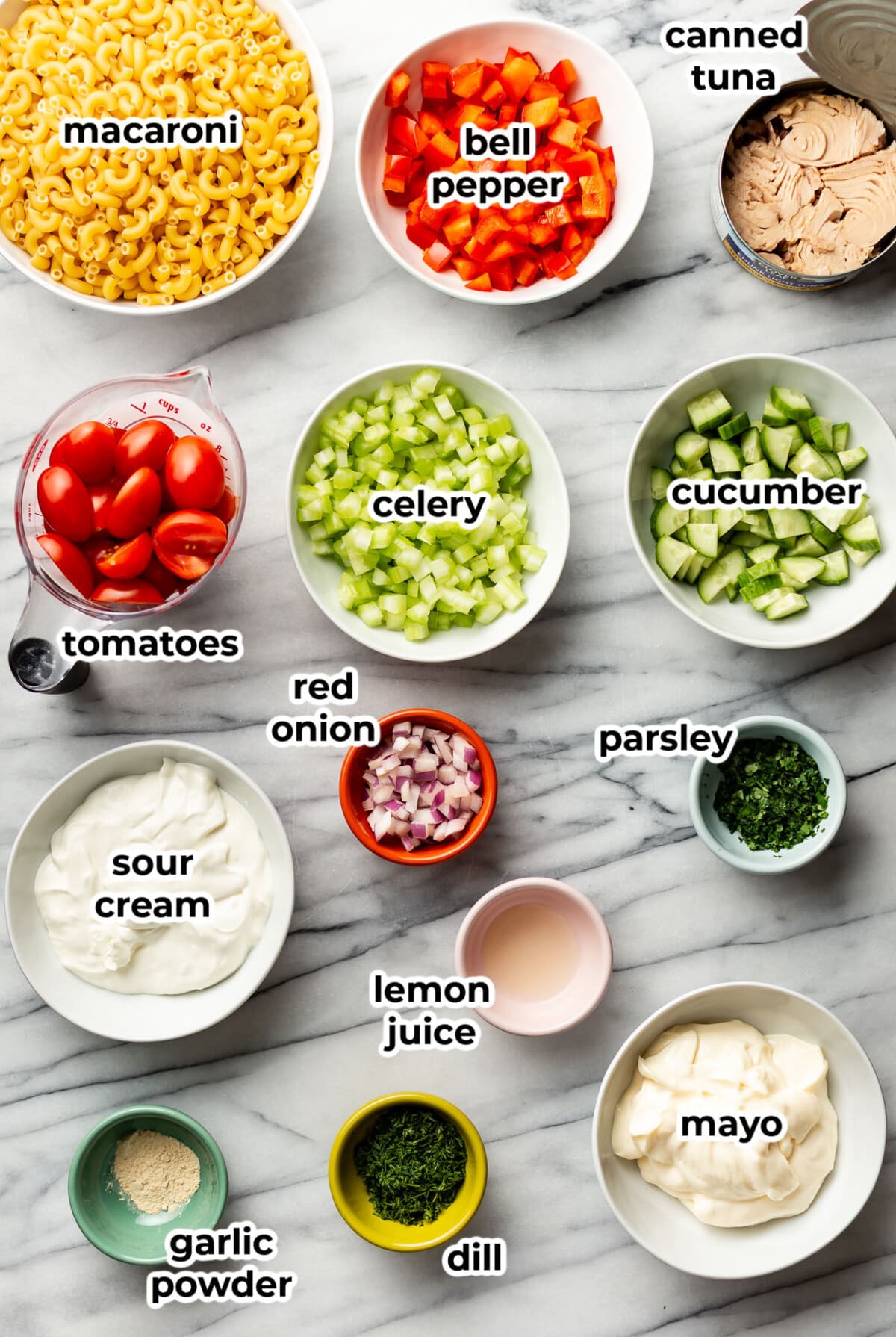ingredients for creamy tuna pasta salad in prep bowls