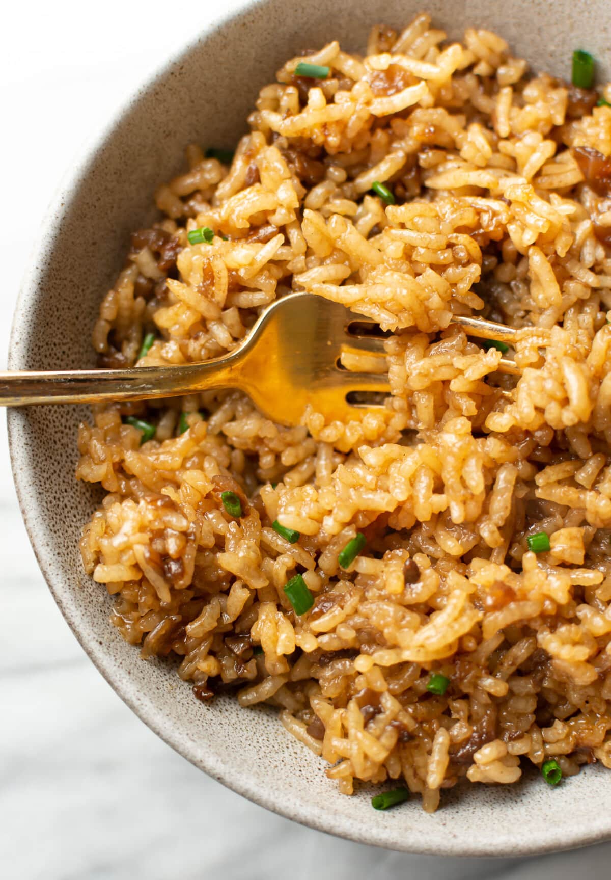 a bowl of stick of rice butter with a fork