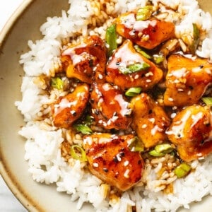 a bowl of teriyaki chicken over jasmine rice