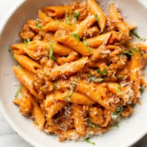 a bowl of penne alla vodka with sausage