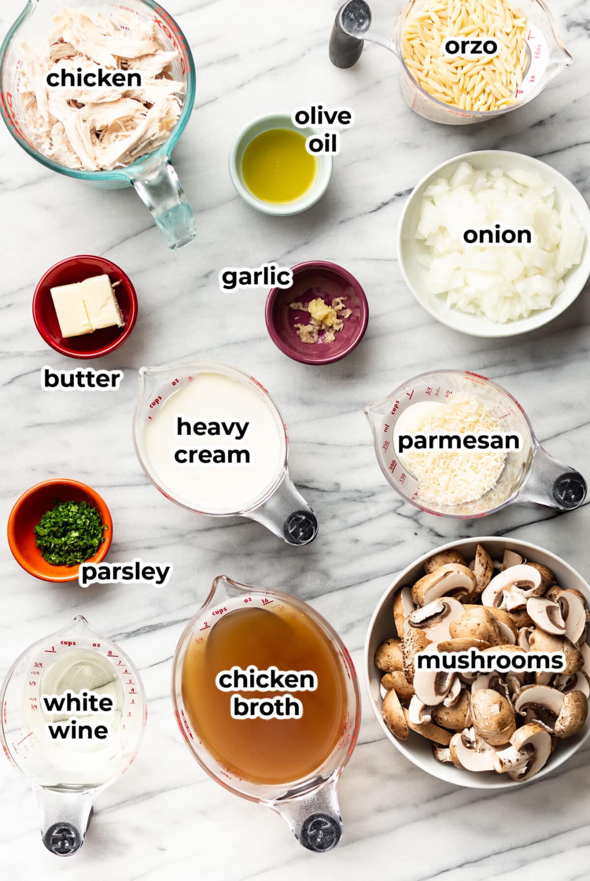 ingredients for creamy chicken mushroom orzo in prep bowls