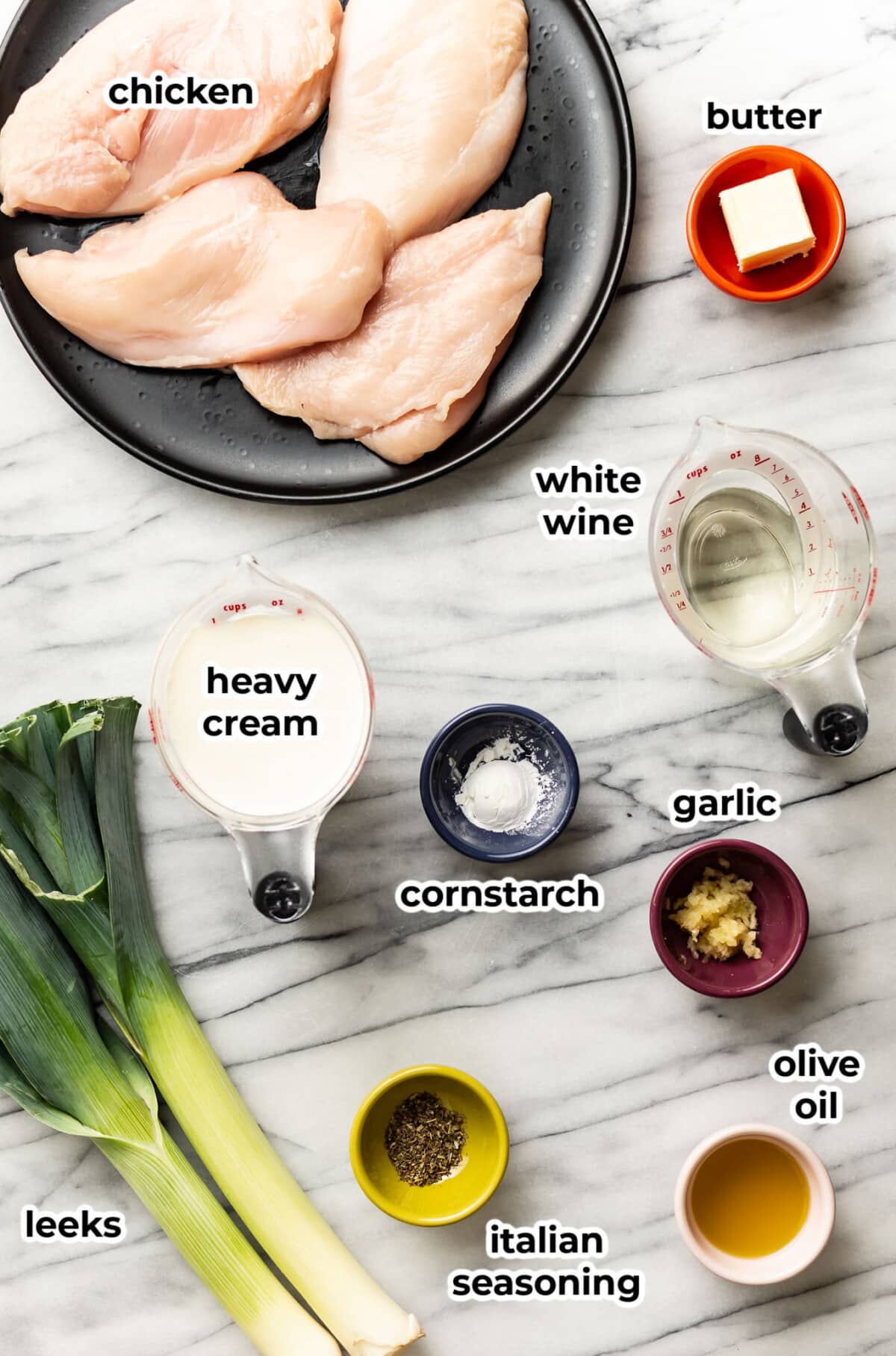 ingredients for creamy leek chicken in prep bowls