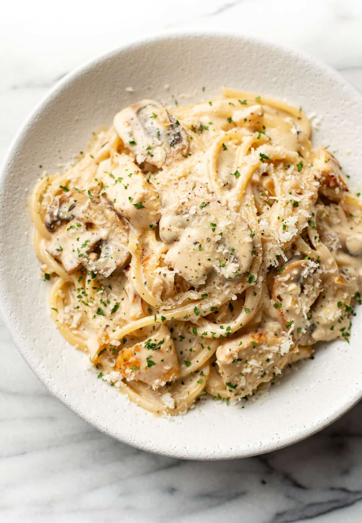 a bowl of chicken mushroom pasta