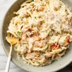 a bowl of crab pasta with a fork