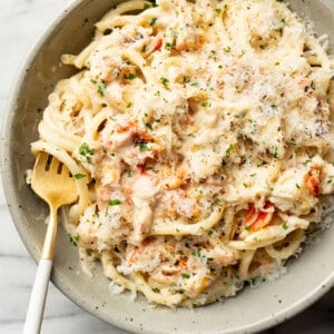 a bowl of crab pasta with a fork