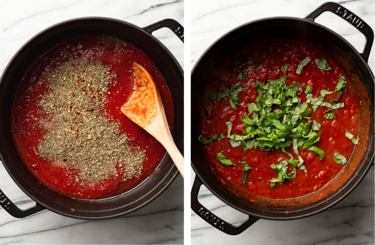adding basil and oregano to a pot of homemade tomato sauce