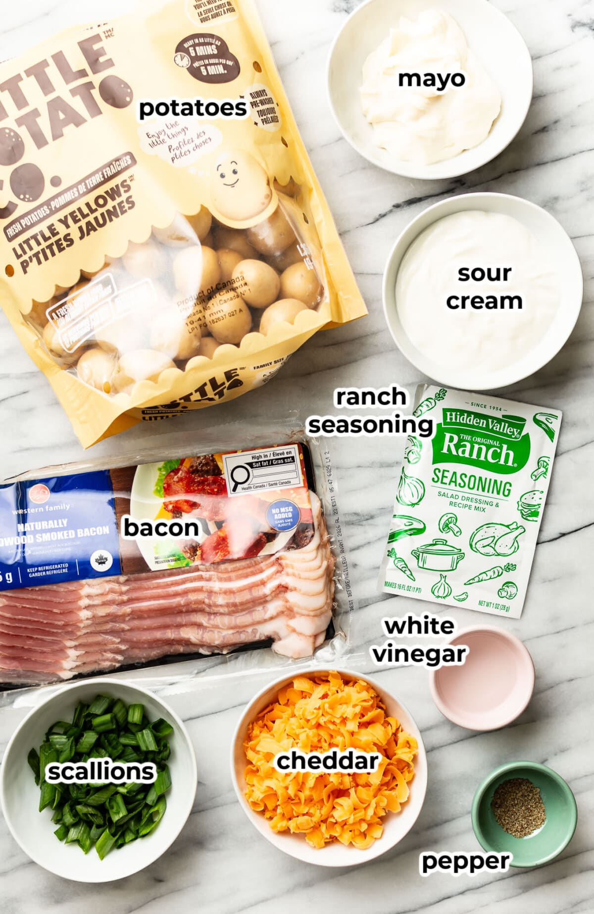 ingredients for bacon ranch potato salad in prep bowls