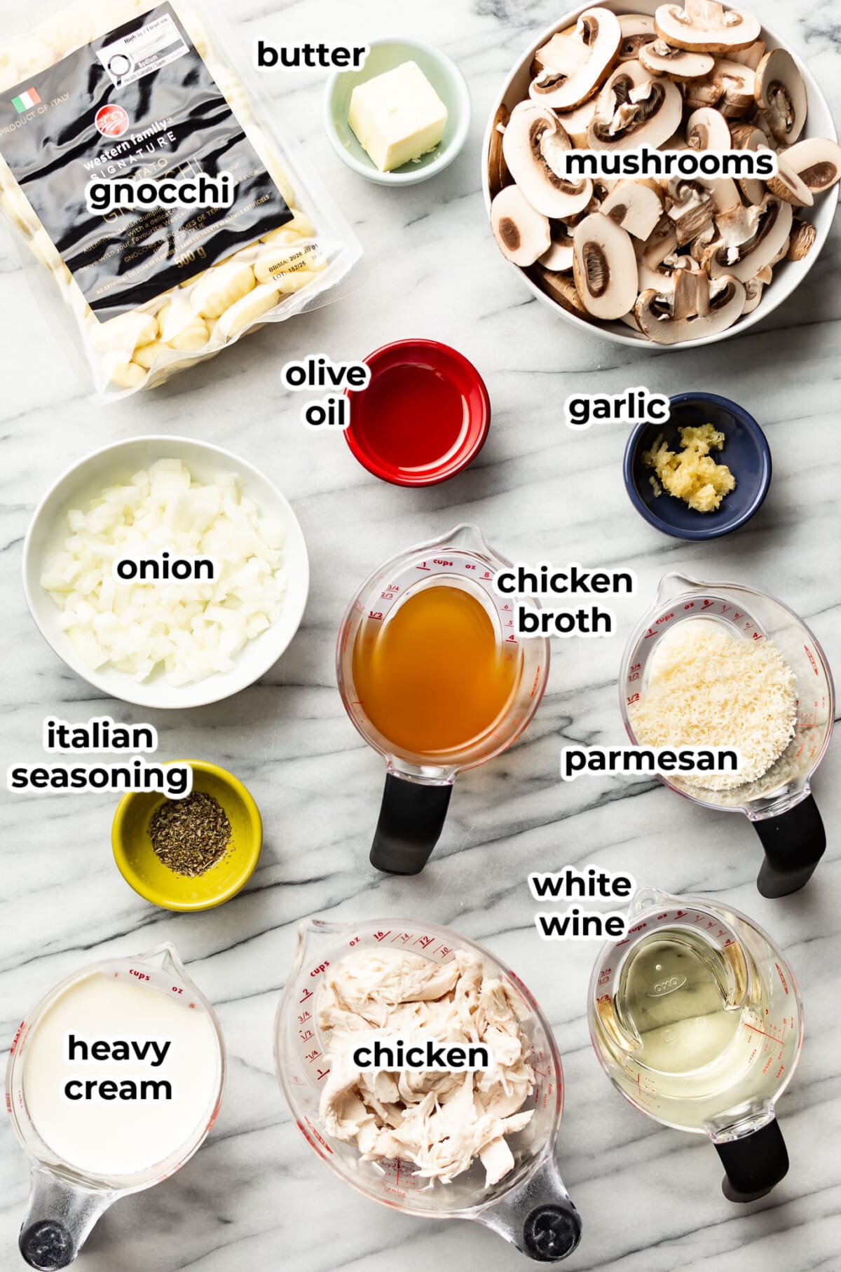 ingredients for chicken mushroom white wine gnocchi in prep bowls