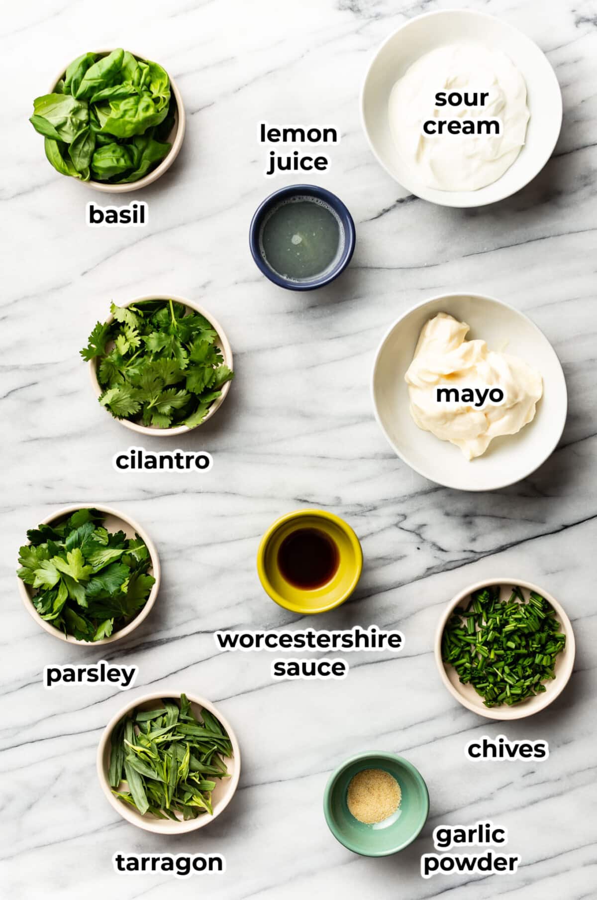ingredients for homemade green goddess dressing in prep bowls