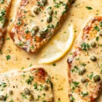 a skillet with pork chops piccata