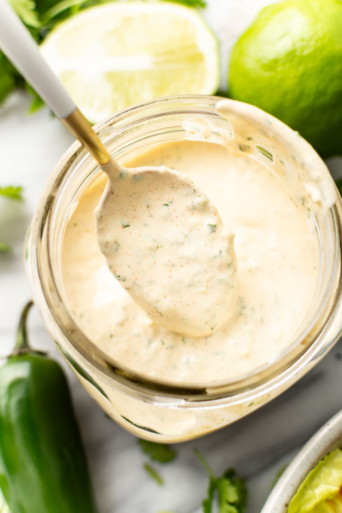 a mason jar with homemade jalapeno ranch dressing