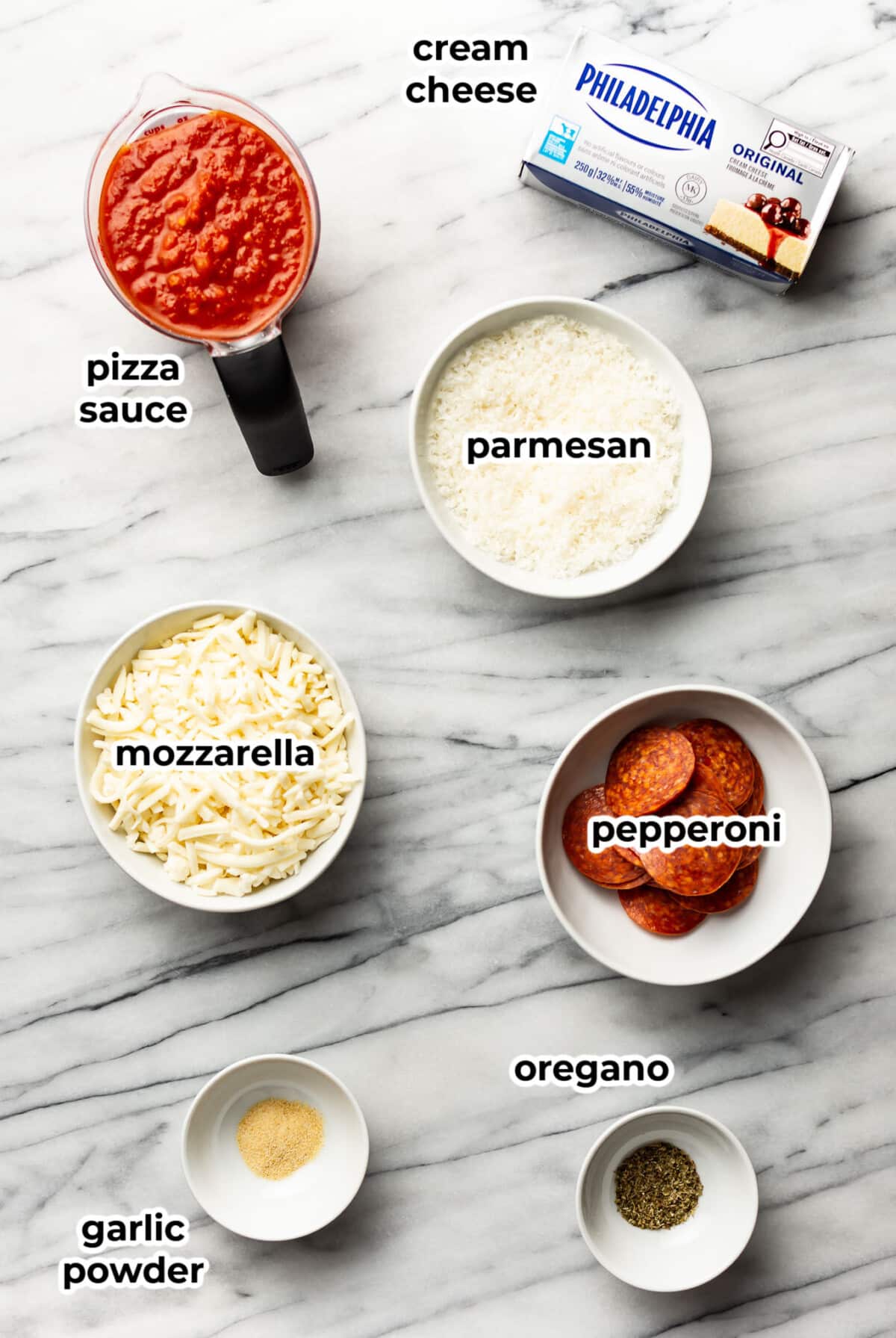 ingredients for pepperoni pizza dip in prep bowls