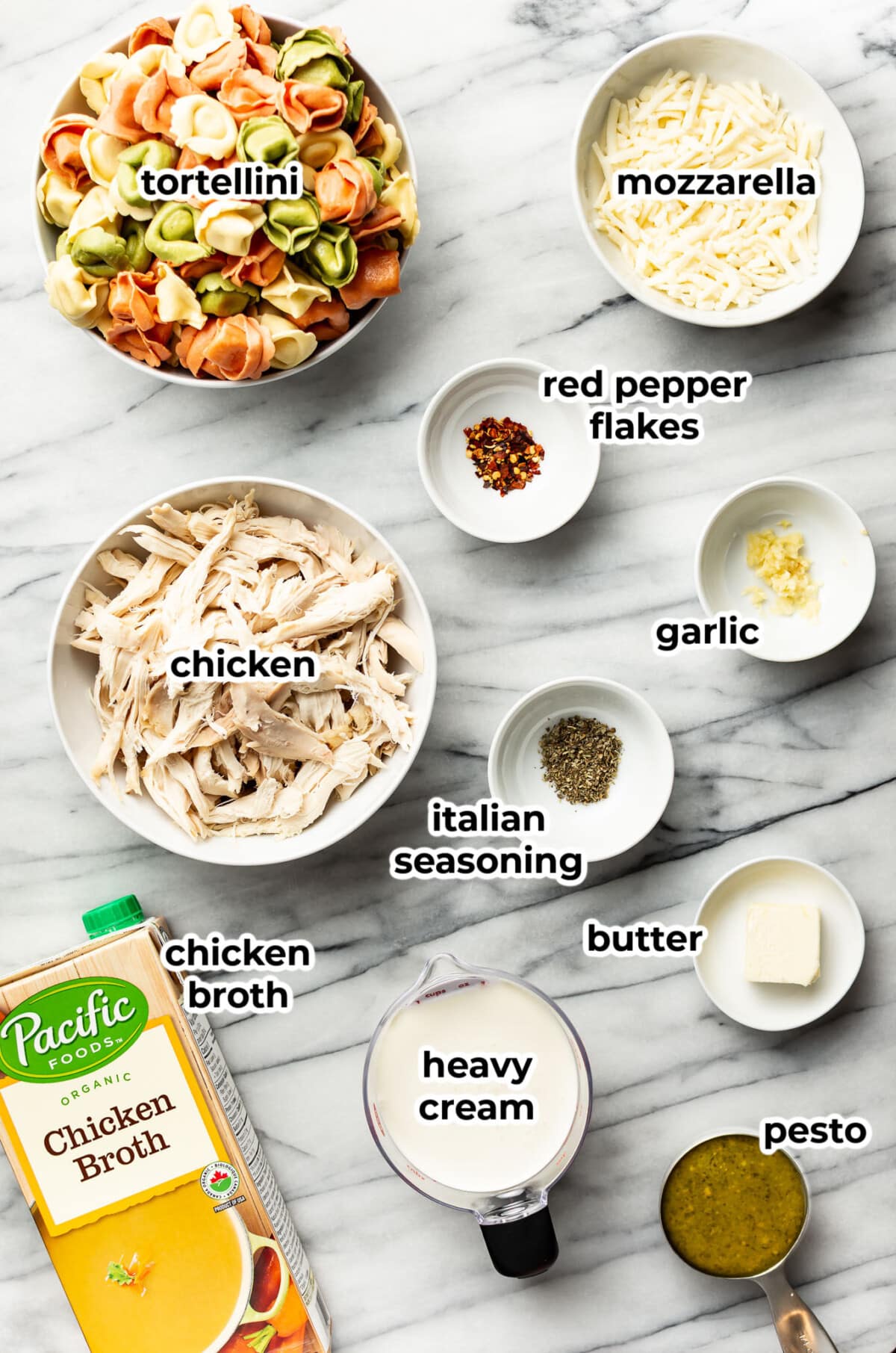 ingredients for pesto chicken tortellini in prep bowls