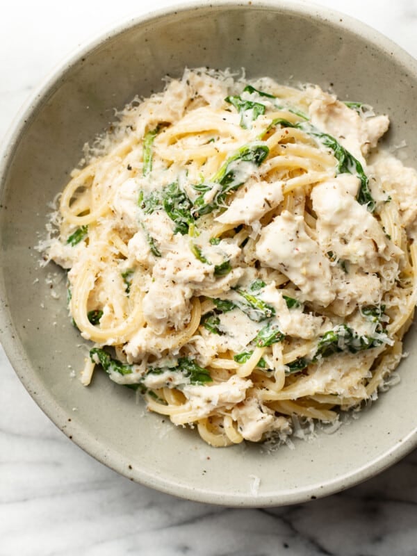 a bowl of lemon spinach chicken pasta