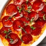 a baking dish with pepperoni pizza dip