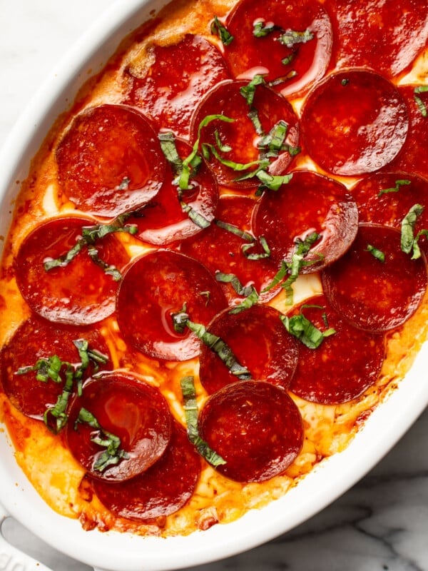 a baking dish with pepperoni pizza dip