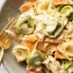 a bowl with pesto chicken tortellini