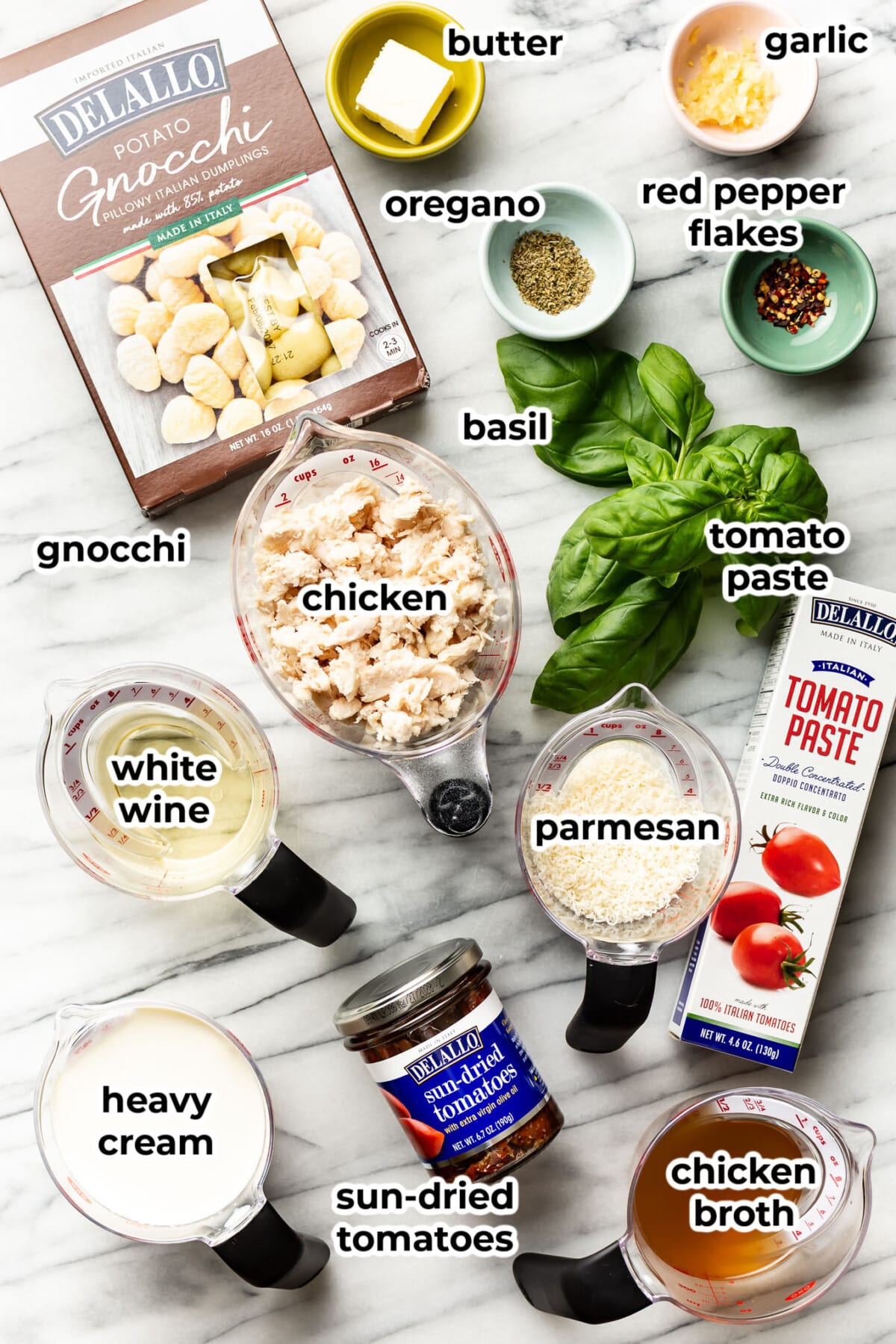 ingredients for marry me chicken gnocchi in prep bowls