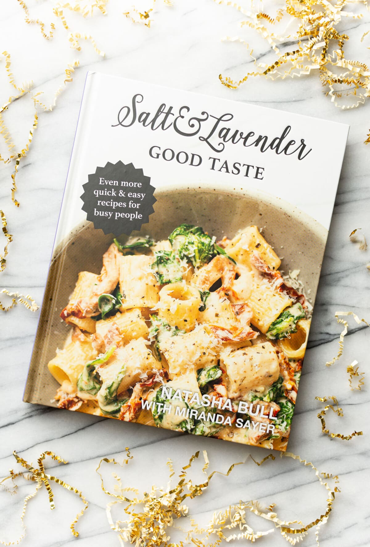 the salt and lavender good taste cookbook on a marble surface