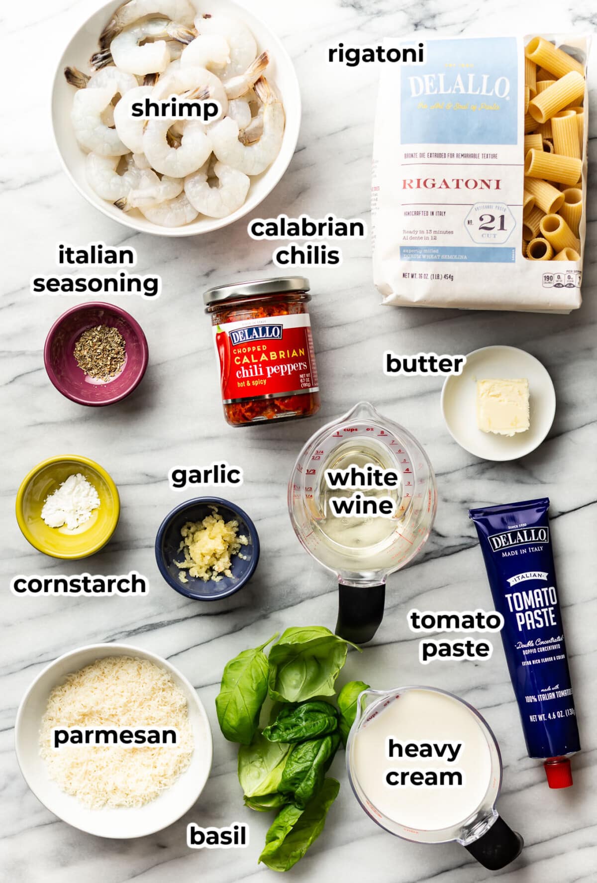 ingredients for spicy shrimp rigatoni in prep bowls